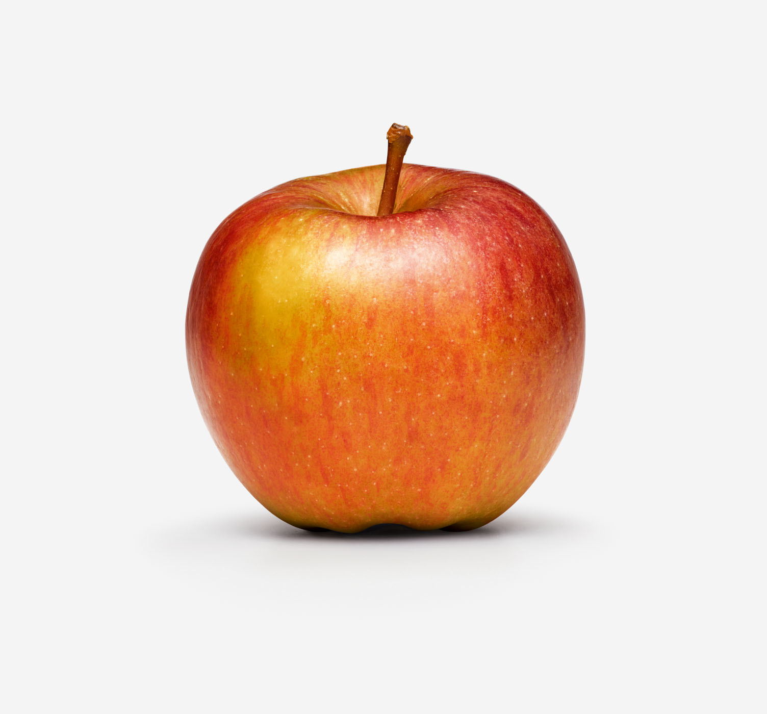 Apple on studio background by Alexander Kent London based still life and product photographer.