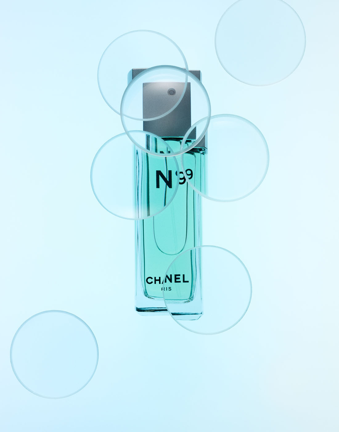 No. 19 perfume with lenses in blue world by Alexander Kent London based still life and product photographer.