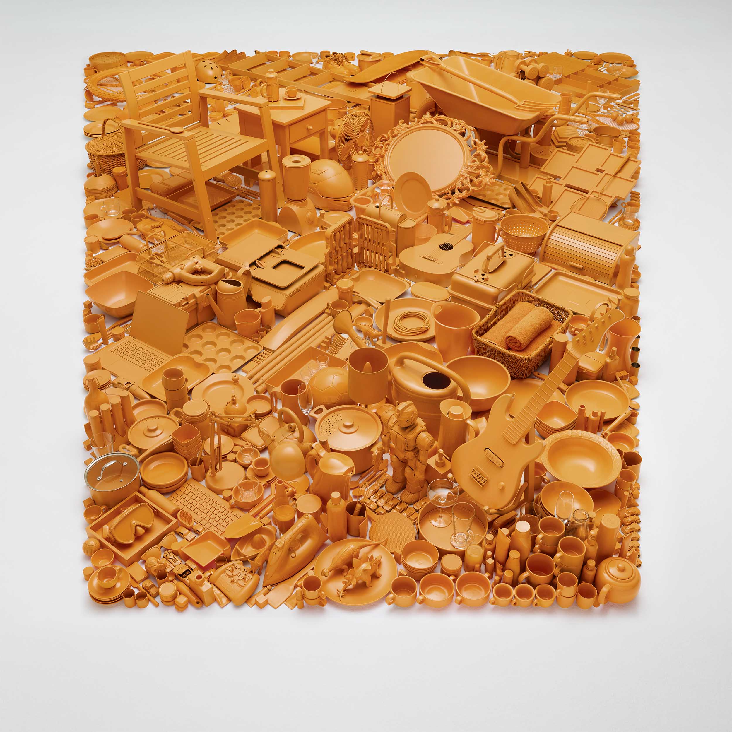 Orange products forming a square on studio floor by Alexander Kent London based still life and product photographer.