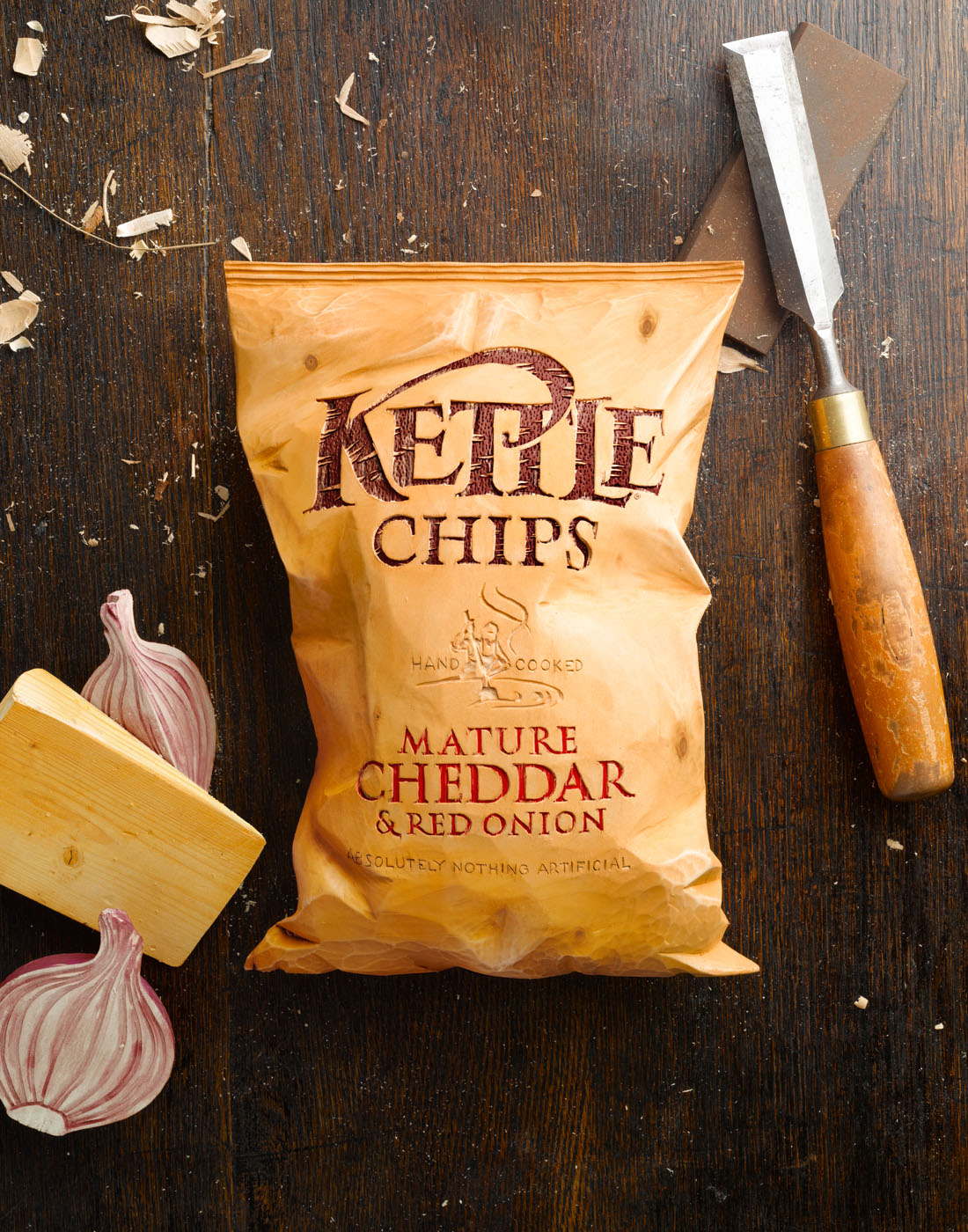 Wooden crisp packet carving in studio by Alexander Kent London based still life and product photographer.