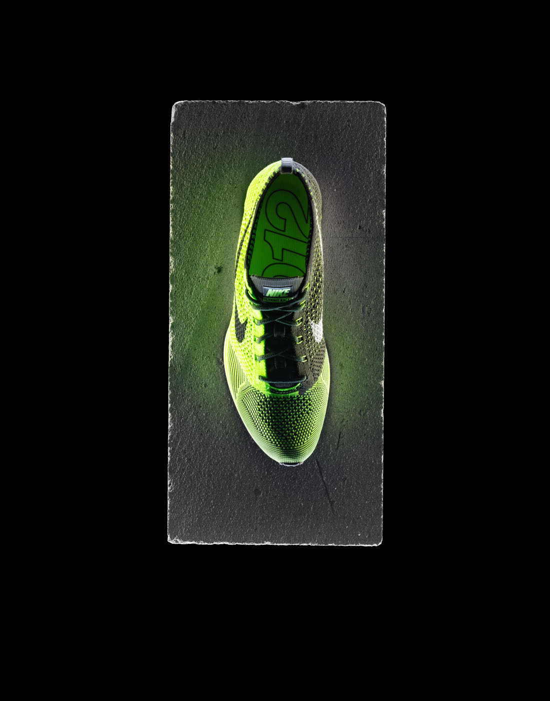 Nike running shoe on concrete block by Alexander Kent London based still life and product photographer.