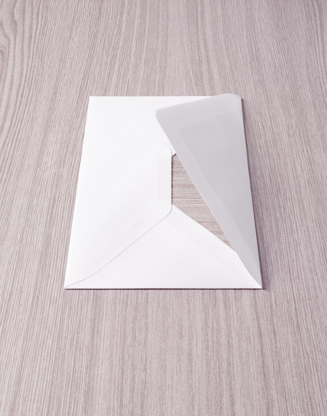 Envelope on same coloured wood by Alexander Kent London based still life and product photographer.