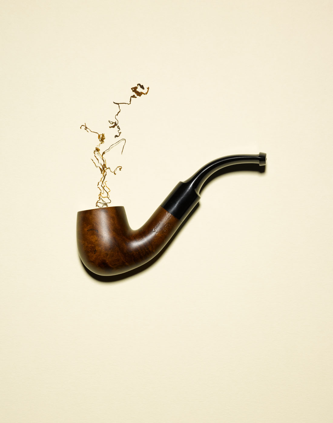 Tobacco smoke coming out of old pipe by Alexander Kent London based still life and product photographer.