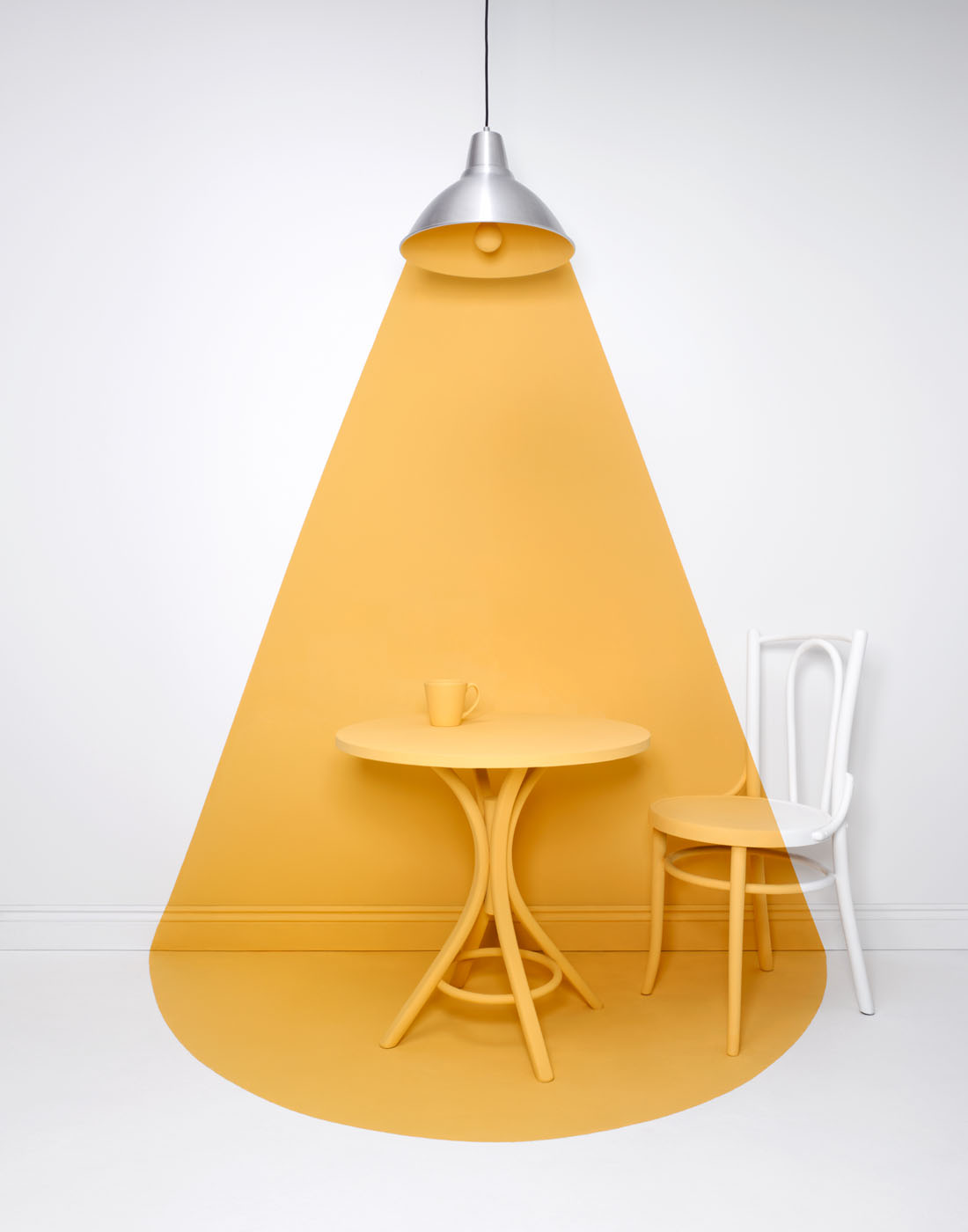 Painted yellow light beam by Alexander Kent London based still life and product photographer.